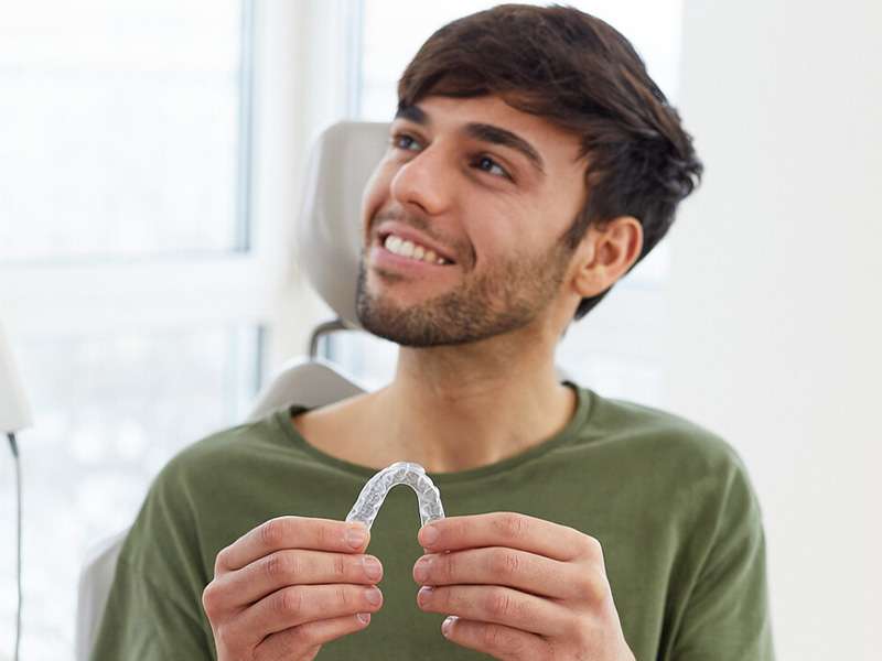 A young man with DR SMILE dental aligners